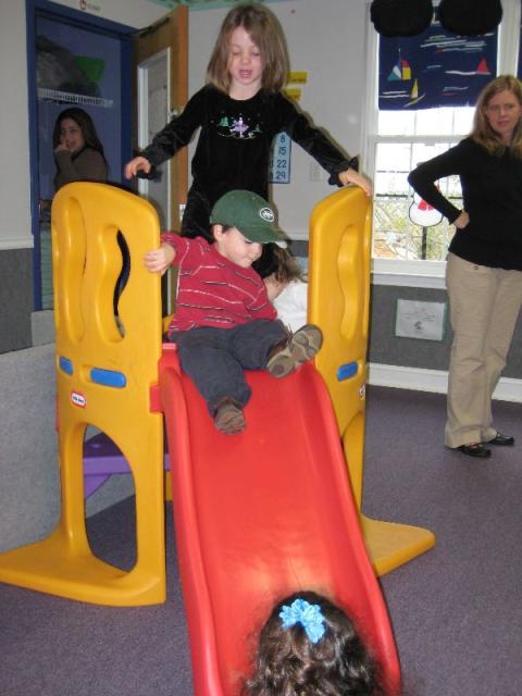 J goes down the slide, just a few weeks after the cast came off (we were a bit nervous watching him)