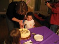 Aunt Laura cuts the delicious cake from Alon's