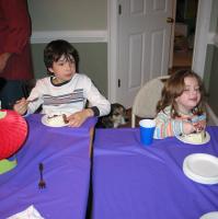 Cleo looks on as Ethan and Ashley eat their cake