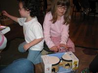 Madison sneaks in a few thwacks on the bongos