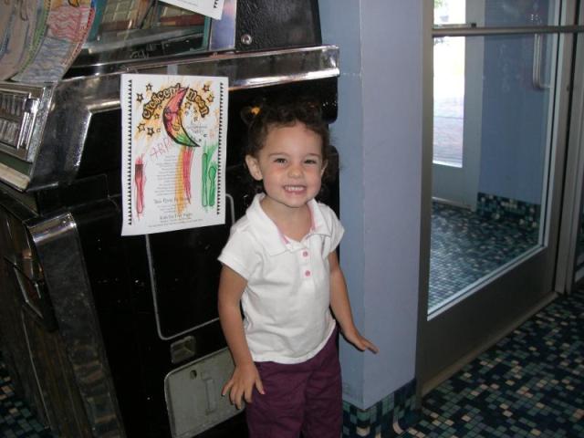 Abby is proud of her picture hanging in Silver Moon.