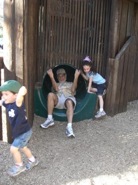 Poppi goes down the slide at Sugar Sand Park